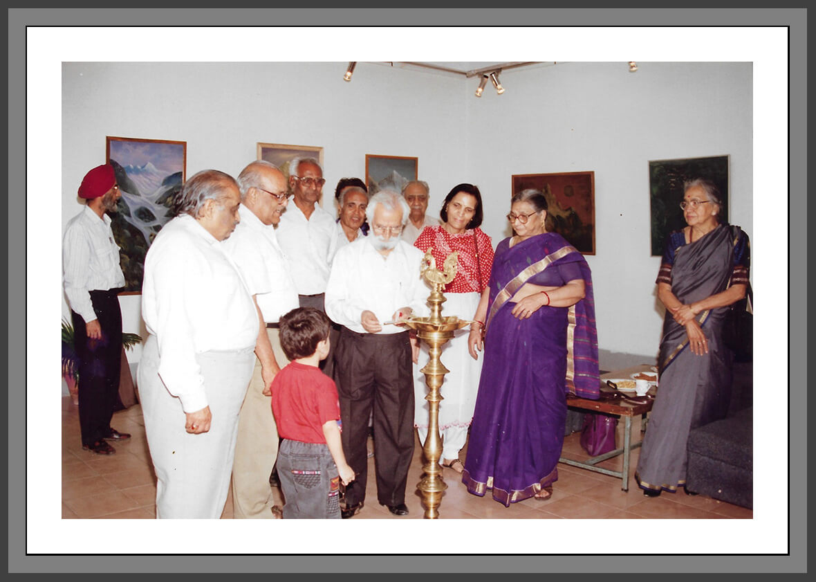 Manohar Kaul lighting the ceremonial lamp